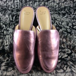 A new day faux leather mules.